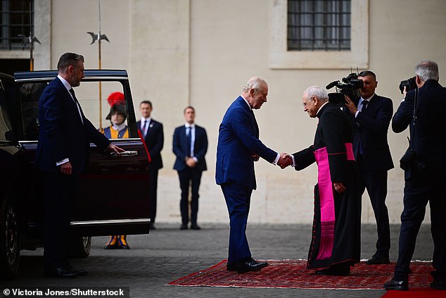 King Charles III and Queen Camilla are welcomed by officials at San Damaso Courtyard today