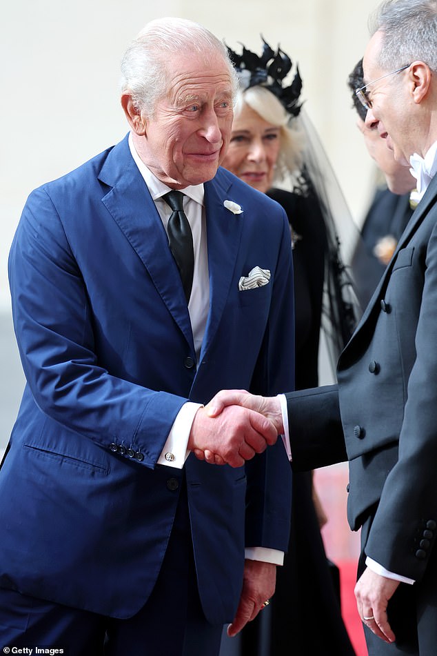 King Charles III is welcomed by officials at San Damaso Courtyard at Vatican City today