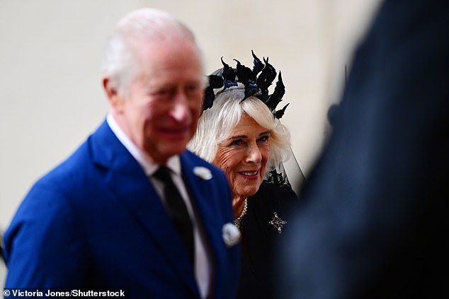 King Charles III and Queen Camilla are welcomed by officials at San Damaso Courtyard today