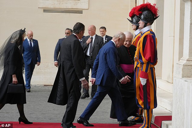 King Charles III and Queen Camilla are welcomed by officials at San Damaso Courtyard today