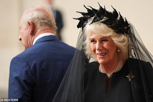 King Charles III and Queen Camilla are welcomed by officials at San Damaso Courtyard today