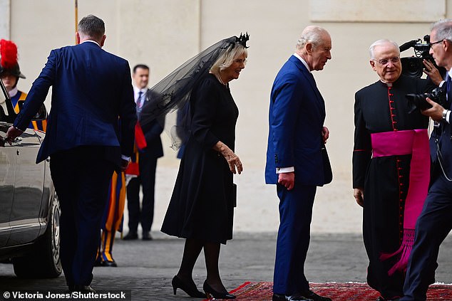 King Charles III and Queen Camilla are welcomed by officials at San Damaso Courtyard today