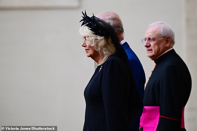 King Charles III and Queen Camilla are welcomed by officials at San Damaso Courtyard today