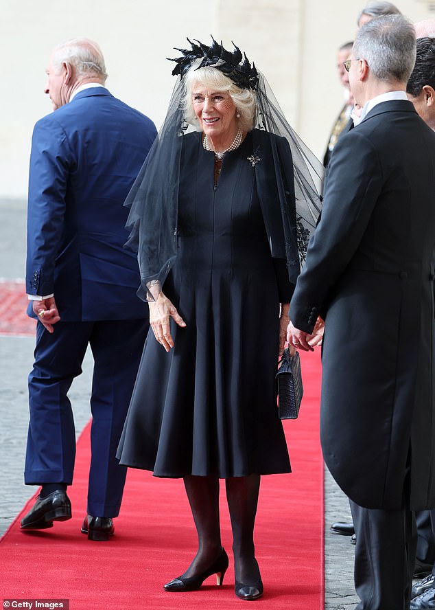 King Charles III and Queen Camilla are welcomed by officials at San Damaso Courtyard today
