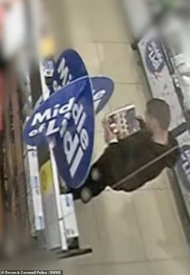 Davis is seen on CCTV shopping for the murder weapon after being allowed to leave hospital - he would purchase a kitchen knife and two bottles of vodka