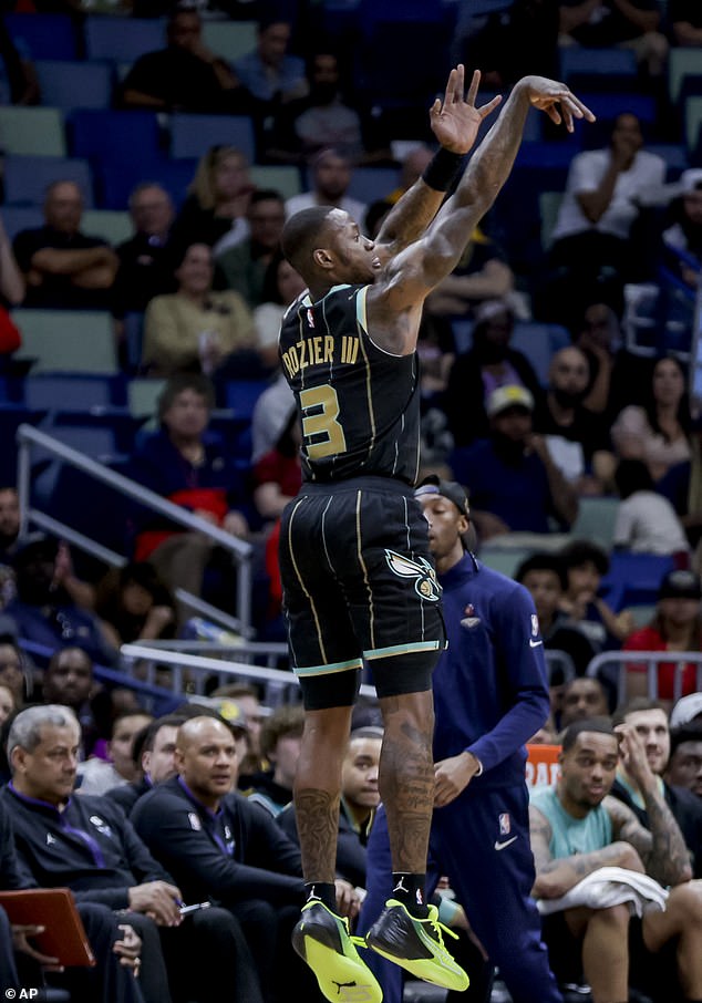 Charlotte Hornets guard Terry Rozier (3) shoots over New Orleans Pelicans forward Herbert Jones (5) in the first quarter of an NBA basketball game in New Orleans, Thursday, March 23, 2023. (AP Photo/Derick Hingle)