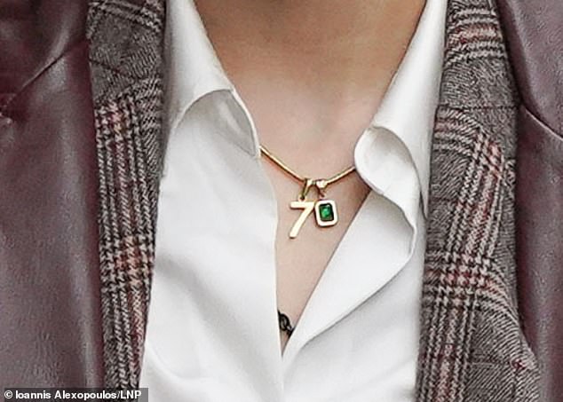 The gold number 'seven' charm was previously seen on social media posts by Dr Aladwan