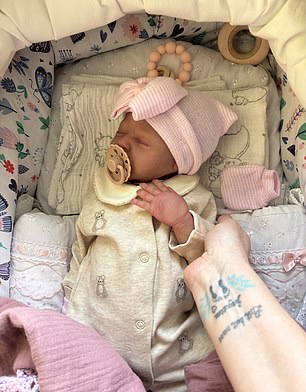 One of her real-life children, Taylor, says she supports her mum's hobby but has no interest in the dolls herself