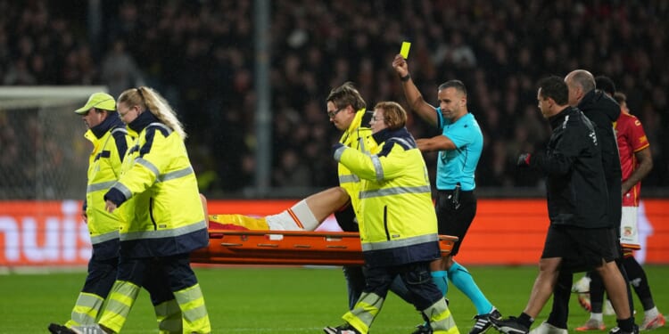 Watch bizarre moment Go Ahead Eagles star given yellow card... as he gets STRETCHERED OFF pitch vs Aston Villa