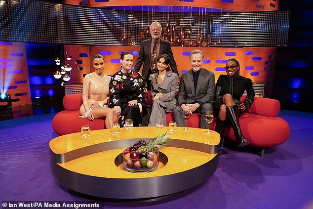 The reality star's outfit displayed every inch of her famous curves as she joined her co-star Sarah Paulson and fellow guests Rachel Zegler, Bryan Cranston and Little Simz on the show