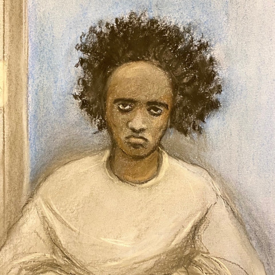 Illustration of Axel Rudakubana, a Black man with a serious expression and dark curly hair, wearing a light-colored top, sitting at a wooden table in a courtroom.