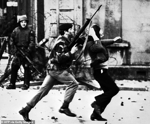 A British soldier drags a Catholic protester during Bloody Sunday in 1972