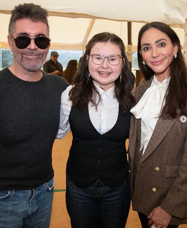 However, pictures of Lauren posted nine days ago at the Great Ormond Street Hospital clay pigeon shoot reveal she is not wearing a wedding ring (Pictured), just the diamond sparkler Simon proposed with in 2021