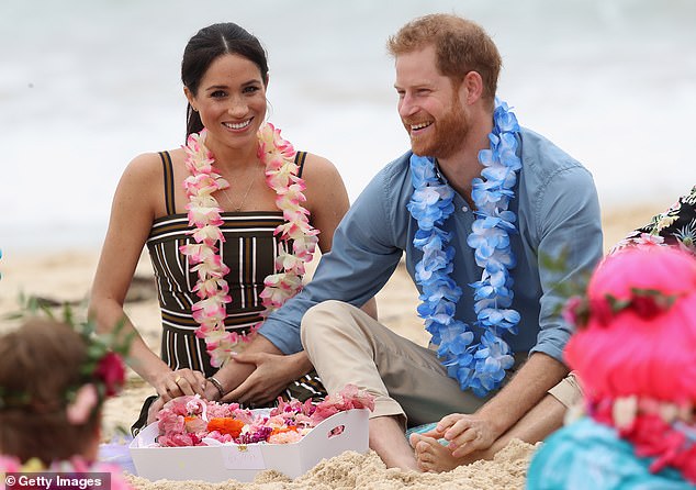 Prince Harry and Meghan during their 16-day tour of Australia in 2018, with the Duke opting for a more relaxed chat at South Bondi Beach