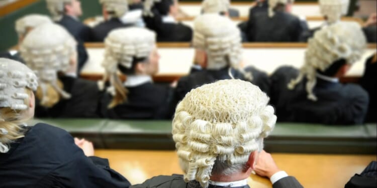 British criminal courts to make major change that will end 350-year tradition after barristers raised complaints
