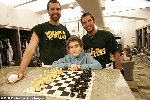 Naroditsky was already a chess champion in 2008, aged 12. Pictured with baseball players of the Oakland Athletics that April
