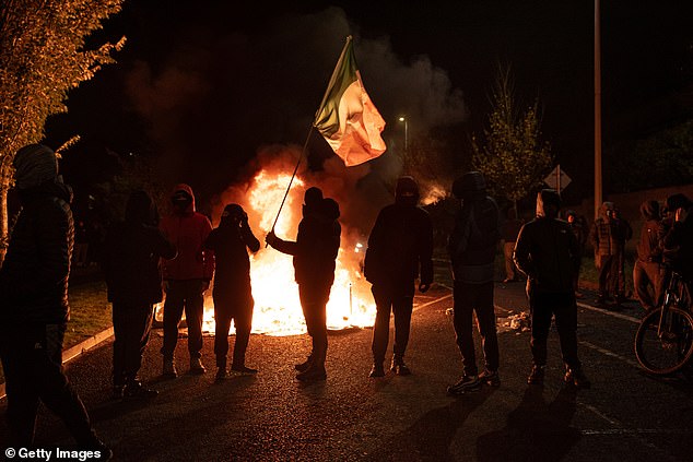 The suburb exploded into a scene of chaos as protestors set bins on fire (pictured) near the Citywest hotel complex on October 21, 2025 after reports that a ten-year-old Irish girl had been sexually assaulted