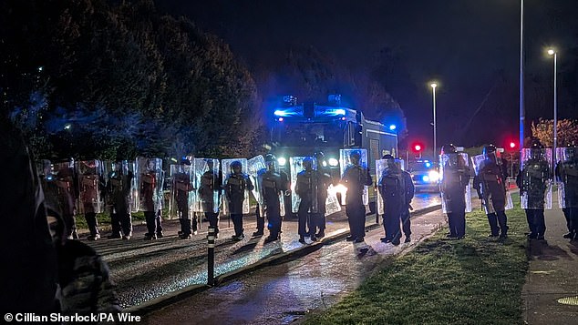 Gardai officers arrived on October 21 with more kit including armoured riot police (pictured)