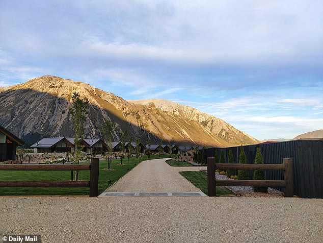 Connected by winding, asphalt paths, each of Flockhill's seven, two-bedroom alpine chalet-style wooden villas is perfectly positioned to take in the views of the surrounding mountains, which rise up at the edge of a vast carpet of green lawn