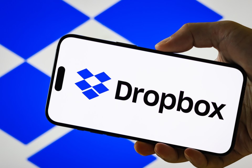 Dropbox Inc. logo displayed on smartphone with blue background
