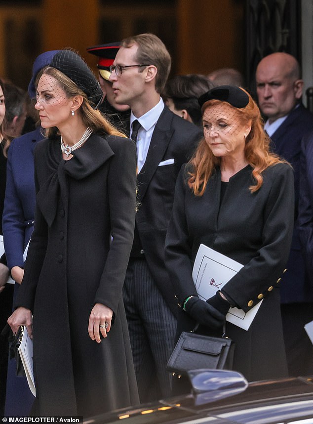 According to body language expert Judi James, Kate's deliberate evasion showed her fulfilling her role as 'the Royal Firm's protective huntress' by seeking to 'ward off any unwanted attention and posing on behalf of her husband'