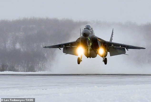 A Mikoyan MiG-29KUB carrier-based multirole trainer aircraft of the Russian Northern Fleet's naval aviation lands at the Severomorsk-3 airfield in the Arctic Circle