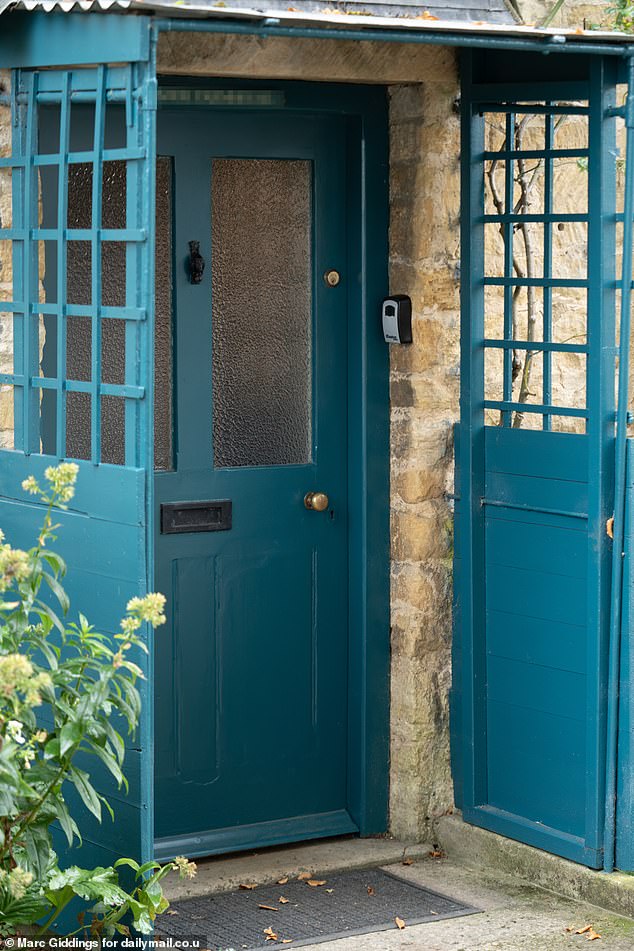 Pictured: A holiday let that has been painted a teal blue. The traditional colours of front doors in Snowshill are Cotswolds Green or white