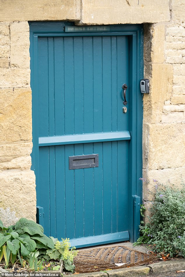 Pictured: Another door painted in a teal blue. Councillor Hands told the Daily Mail they had received enquiries from the parish council and villagers for years asking for the changes to be brought in