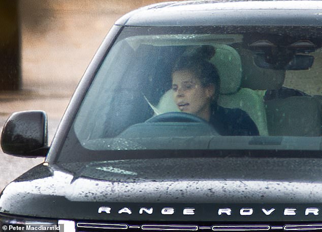 A distressed-looking Princess Beatrice leaving Royal Lodge after the family 'summit' on Monday