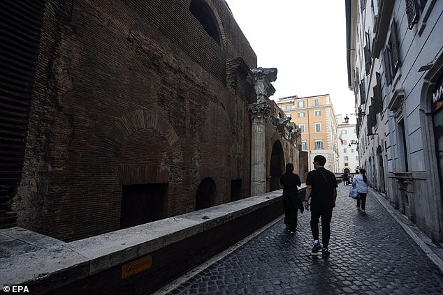 According to police, the man was sitting on the edge of the wall before dropping 22 feet