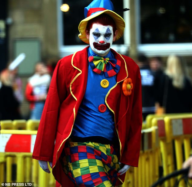 2019 - Some students enjoyed the spooky celebration with scary costumes while others opted for clown themed outfits as they braved the rainy conditions