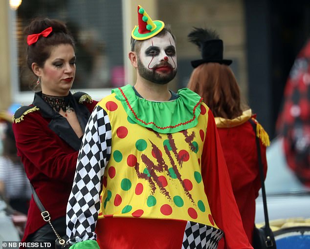 This party-goer went all out on his colourful circus themed Halloween costume including face paint as he made his way between pubs
