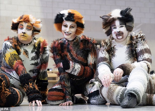 2022 - Three people dressed as cats attend the MCM Comic Con event at the ExCel in east London