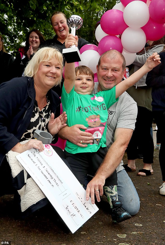 Tony, with Paula and father Mark on a fundraising walk in West Malling Kent at the age of five