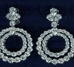 The heavily disguised men ordered staff to empty the display cases at gunpoint