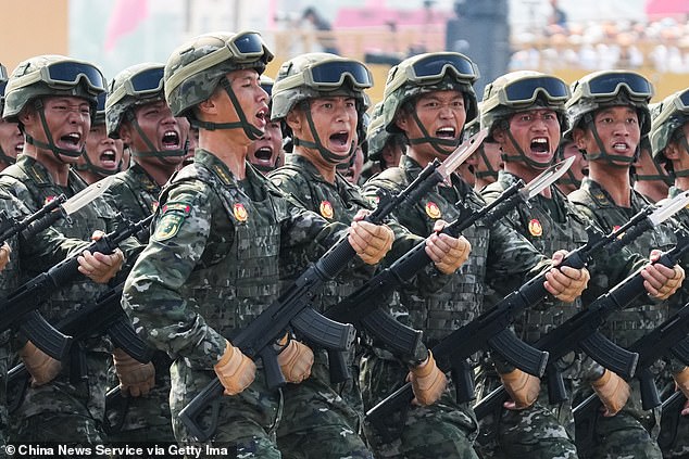 China has renewed threats that it would take over self-ruled Taiwan. Pictured: Formation of the People's Armed Police Force marches through Tian'anmen Square during V-Day military parade to commemorate the 80th anniversary of the victory in the Chinese People's War of Resistance against Japanese Aggression and the World Anti-Fascist War on September 3, 2025 in Beijing, China