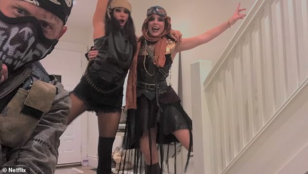 Meghan and Harry pose for a photograph with Eugenie. In a rather ominous indication of what was to come, they opted to attend the Halloween party with an 'apocalypse' theme