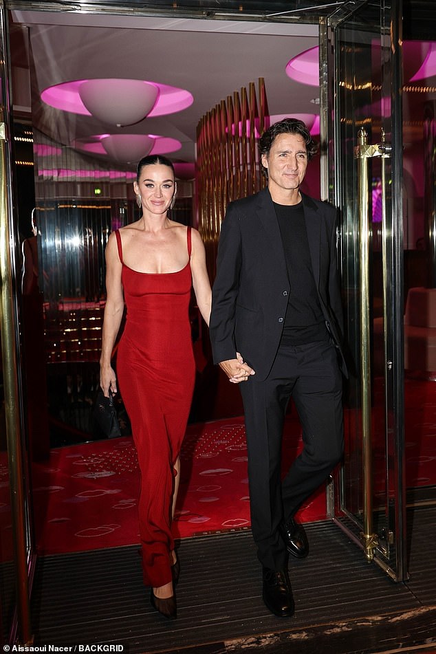 The Dark Horse songstress couldn't contain her smile as she made her relationship official