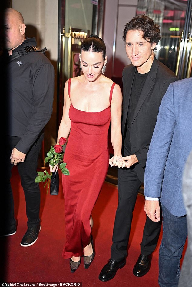 The couple, who first sparked dating rumors in July, looked smitten as they exited the theater and made their way to a chauffeured vehicle