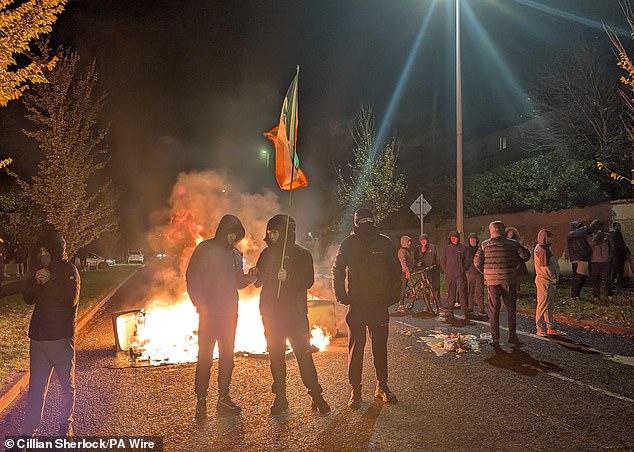 Residents are furious their unassuming home has been transformed into a holding pen for migrants