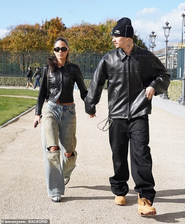 Romeo, 23, and Kim, 25, coordinated during their outing both wearing trendy black leather jackets and jeans