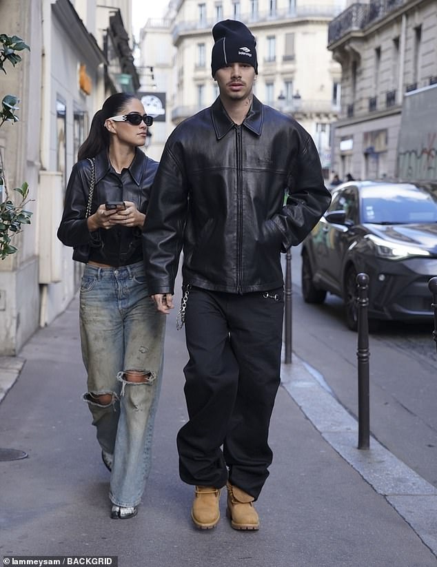 Romeo also walked with his hands in his pockets while Kim checked her phone