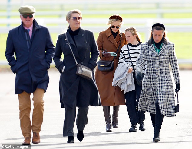 Zara's daughter Mia (second right) looked just as fashionable, with a similarly colour-coordinated look