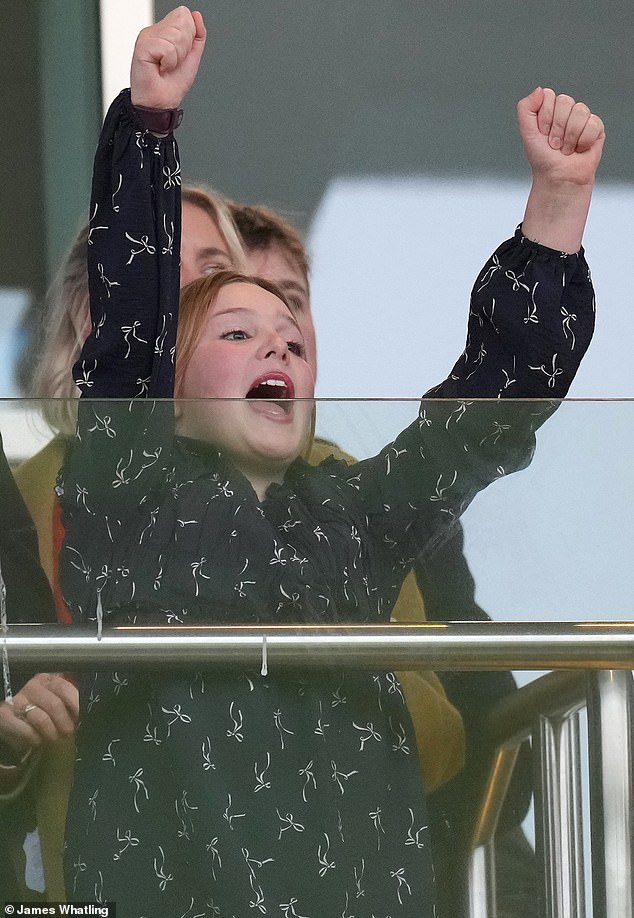 But it was not the first time this year the eldest Tindall showed up at Cheltenham in style. Mia attended the racecourse to watch the New Year's Day races in a sweet long-sleeved navy blue dress with a white bow pattern (pictured)