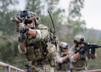 Soldiers in camouflage military uniform on a mission.
