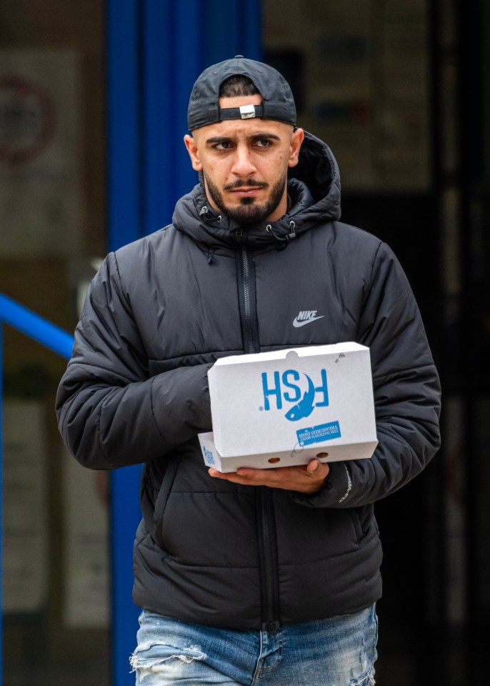 Ashkar Jamal holding a box of fish and chips outside Poole Magistrates Court.