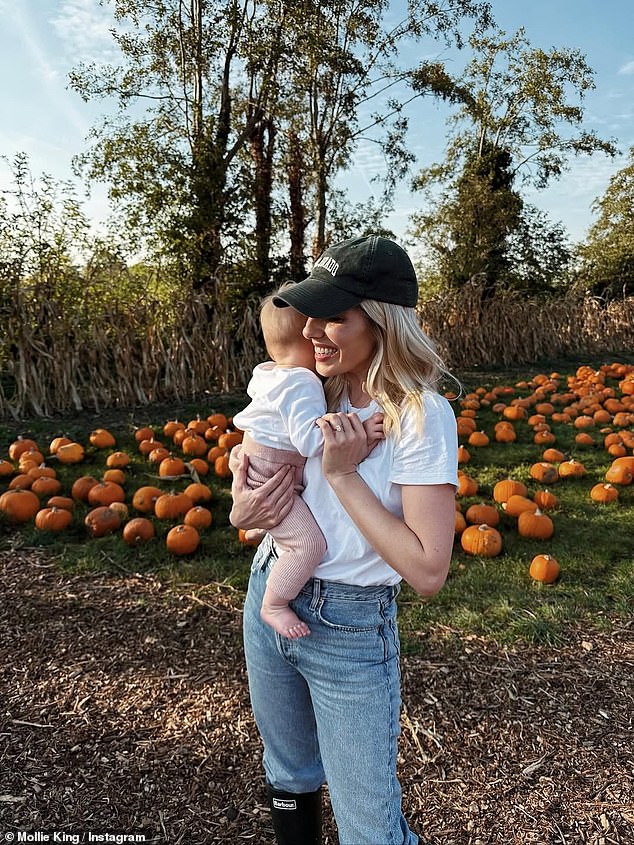 To complete her ensemble, Mollie accessorised her look with a green cap and knee-high black wellingtons