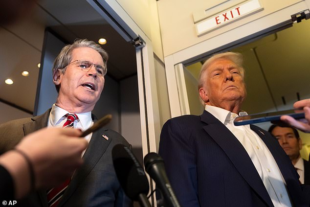 Treasury Secretary Scott Bessent (left) spoke with reporters alongside President Donald Trump (right) during the flight Monday between Malaysia and Japan, giving updates on a brewing Chinese trade deal