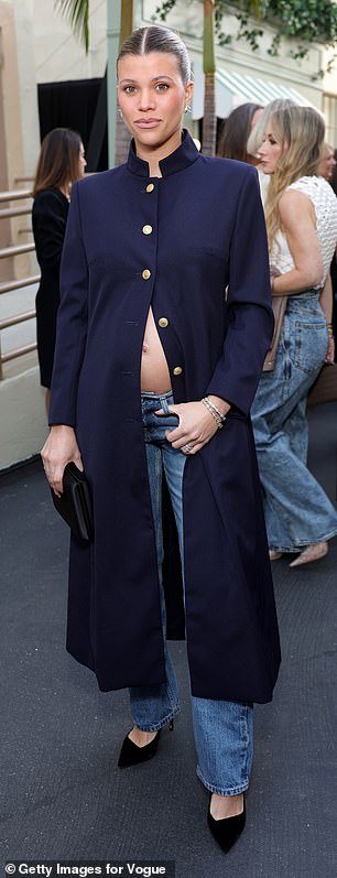 Pregnant Sofia Richie, 27, flashed her baby bump in a halfway unbuttoned navy coat