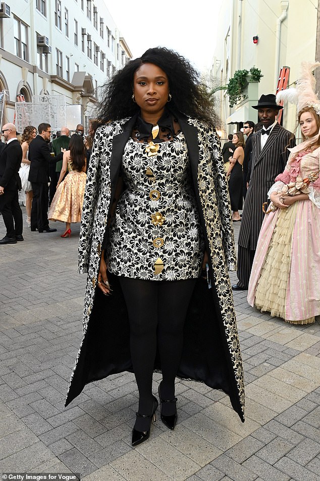 Jennifer Hudson opted for a bold look in a dramatic black and white mini with large gold buttons